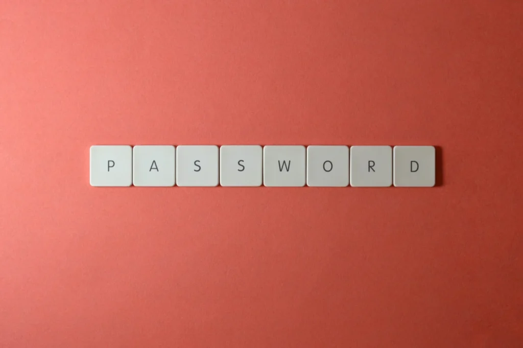 Touches de clavier formant le mot PASSWORD sur un fond rouge
